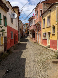 Narrow alley with buildings in background
