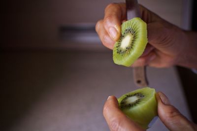 Midsection of man holding apple