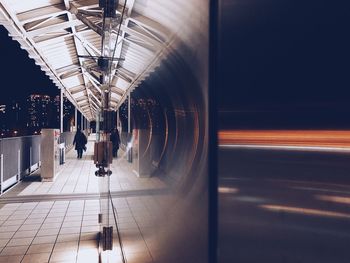 Blurred motion of train at railroad station