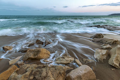 Scenic view of sea shore against sky