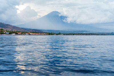 Beautiful balinese seascape view on volcano agung in amed village. bali, indonesia