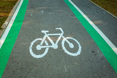 High angle view of arrow sign on road