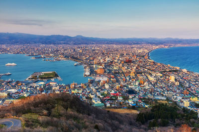 High angle view of townscape by sea