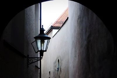 Low angle view of street light against building