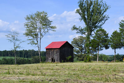 Gazebo on field against sky