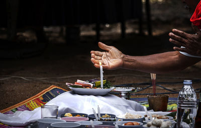 Midsection of person preparing food