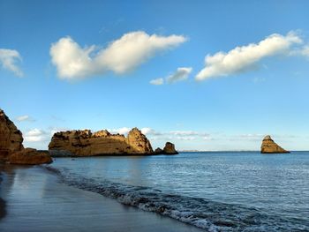 Panoramic view of sea against blue sky