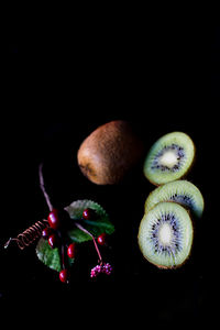 Close-up of fruits against black background