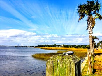 View of calm sea against cloudy sky