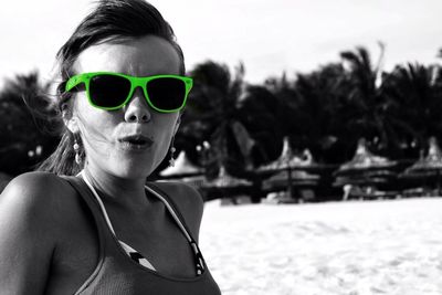 Portrait of young woman relaxing on beach