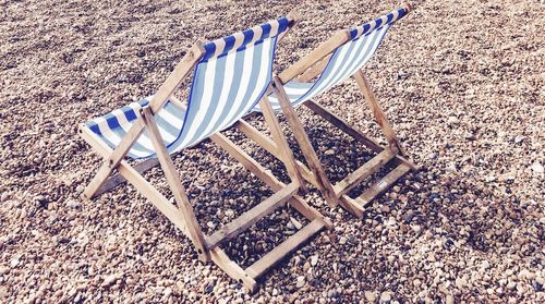 Close-up of chair on sand