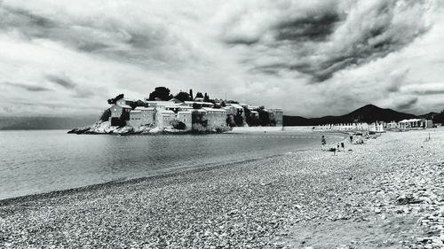 Scenic view of sea against cloudy sky