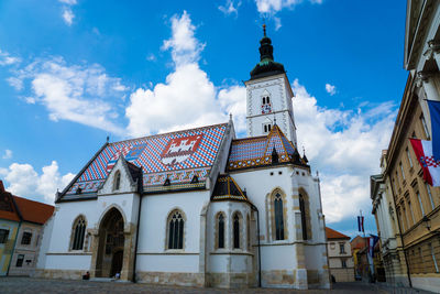 Low angle view of st marks church in town against sky