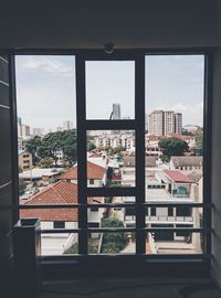 Cityscape seen through window