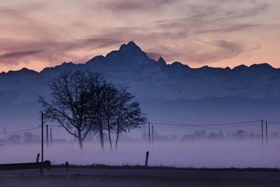 Scenic view of mountains against sky during sunset