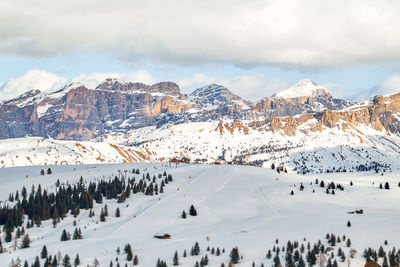 Ski slopes in the dolomites in front of the majestic mountain ranges in south tyrol