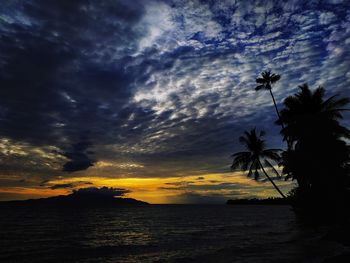 Scenic view of sea against sky at sunset