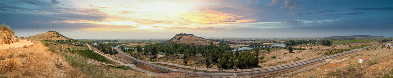 Panoramic view of landscape against cloudy sky