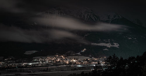 High angle view of illuminated buildings in city at night