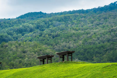 Built structure on landscape against sky