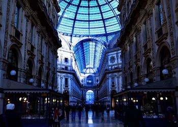 People in illuminated building