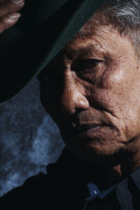 Close-up portrait of man wearing hat