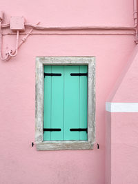 Windows in the colorful house in burano