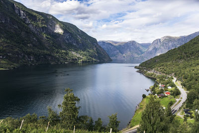 Scenic view of lake and mountains against sky