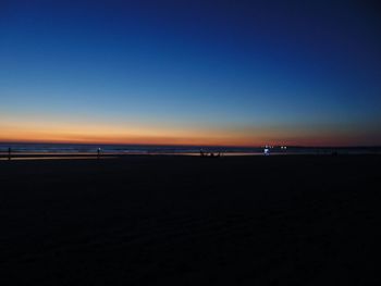 Scenic view of beach at sunset