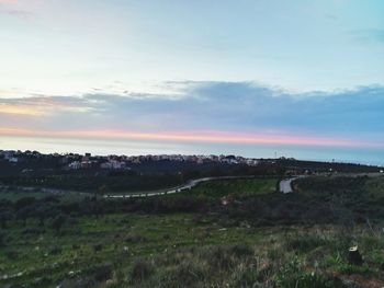 Scenic view of landscape against sky during sunset