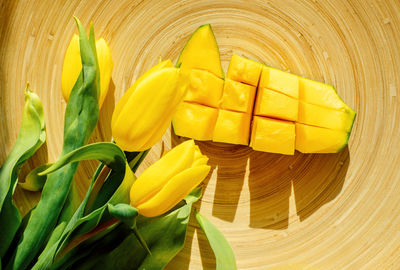 High angle view of yellow roses on table