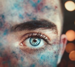 Close-up portrait of man face covered with powder paint