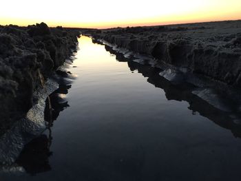 Scenic view of sea against sky at sunset