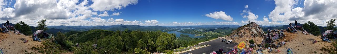 Panoramic view of trees and mountains against sky