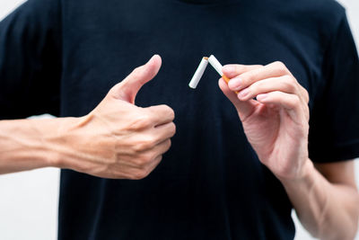 Cropped image of man holding hands