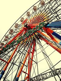 Low angle view of ferris wheel against sky