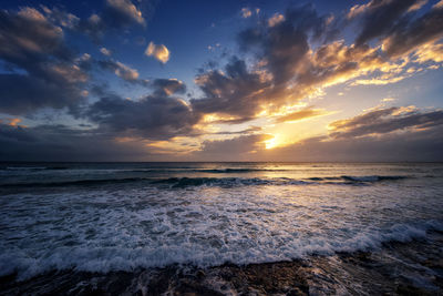 Scenic view of sea against sky during sunset