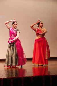 Portrait of young woman standing in traditional clothing