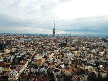 High angle view of city against cloudy sky