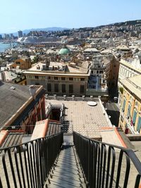 High angle view of houses in town against sky