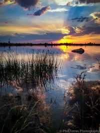 Scenic view of lake during sunset