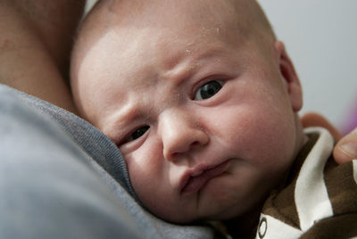 Close-up of cute baby sleeping with mother