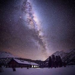 Low angle view of mountain against sky at night