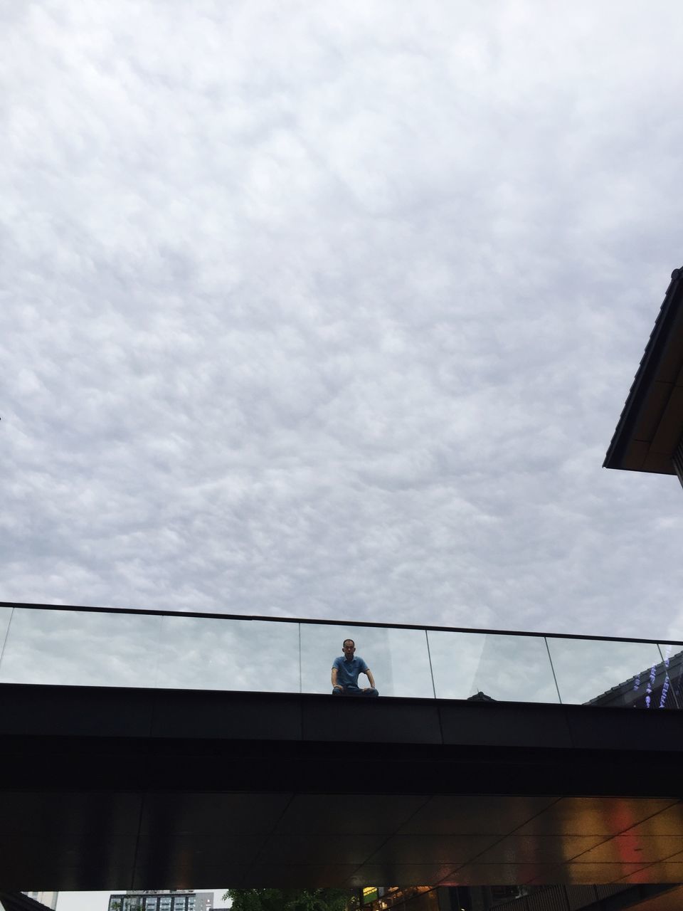 sky, built structure, architecture, building exterior, low angle view, cloud - sky, cloudy, connection, railing, silhouette, cloud, men, weather, overcast, day, bridge - man made structure, building, outdoors