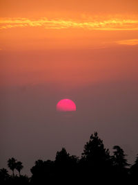 Sun emerging into smoke filled sky due to california forest fires