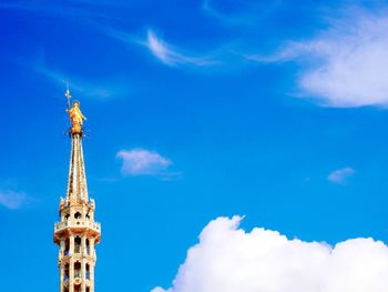 Low angle view of cathedral against cloudy sky