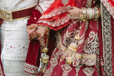 Midsection of woman wearing traditional clothing