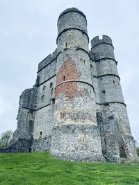 Low angle view of old ruins against sky