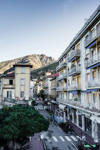 Street amidst buildings against sky