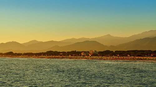 Scenic view of sea against clear sky during sunset